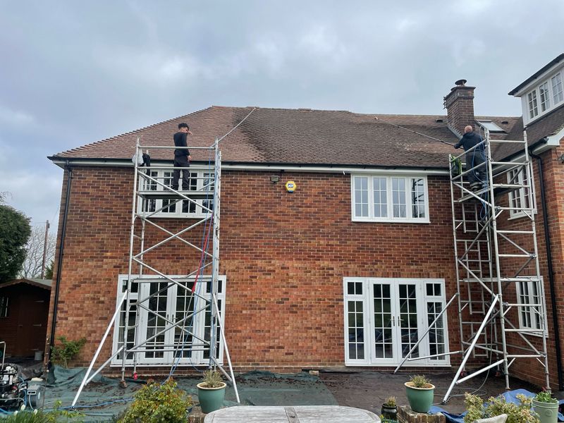 Roof cleaning carried out safely from scaffold towers by The Roof Moss Cleaners in Wootton Bassett